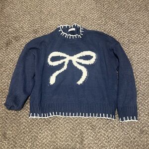 Blue Sweater with White Bow Design